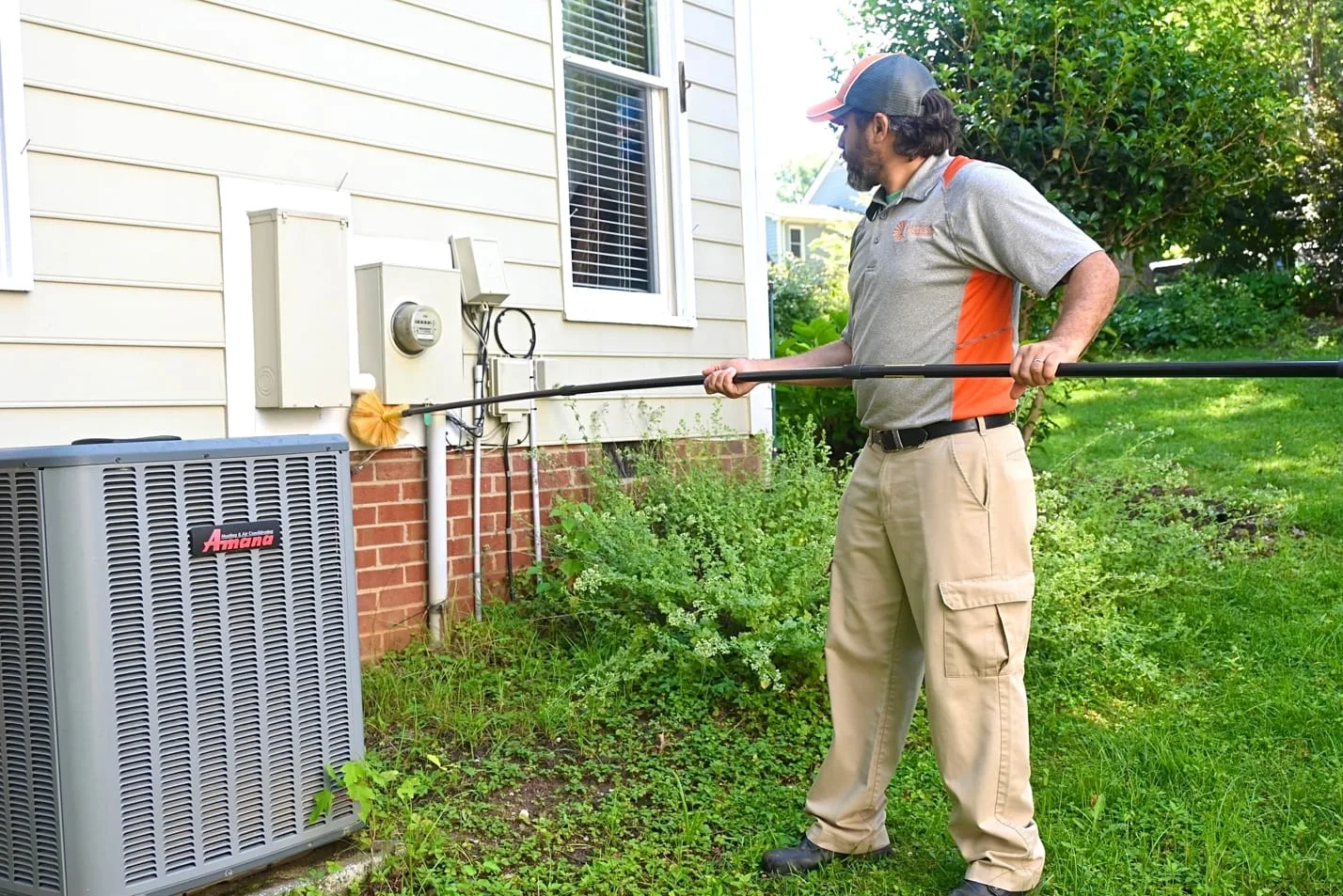 Technician inspecting around the exterior of a home. (Piper Allen, Clegg’s Pest Control Marketing Manager)